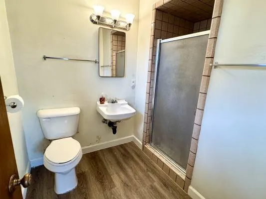 a white toilet sitting next to a bathroom sink