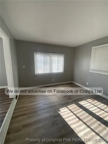 a view of a livingroom with wooden floor