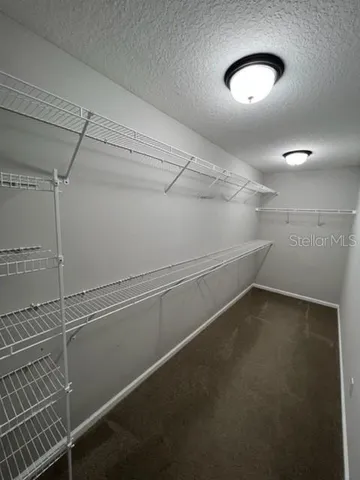 a bathroom with a double vanity sink and mirror