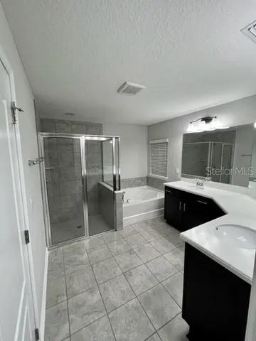 an empty room with a empty space and windows