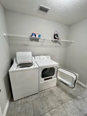 a view of a house with backyard and garden