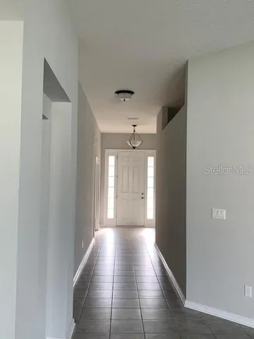 a view of hallway with windows