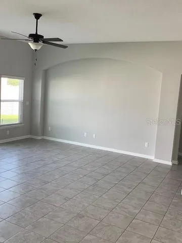 a kitchen with refrigerator and window