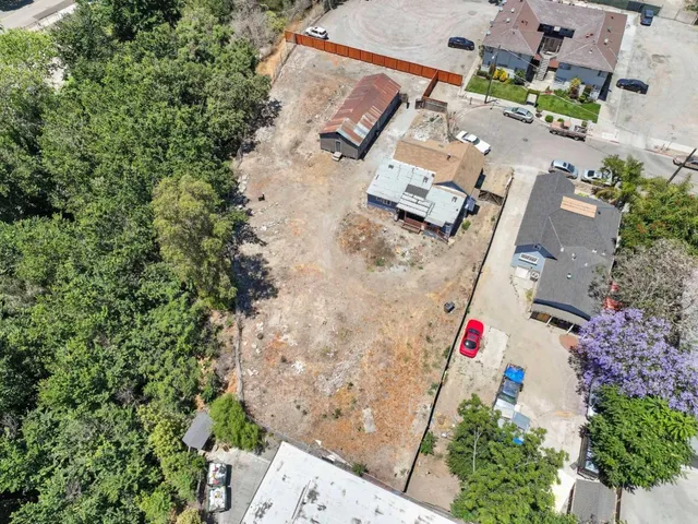 an aerial view of house with yard