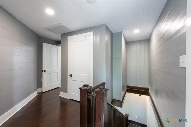 a view of a hallway with workspace