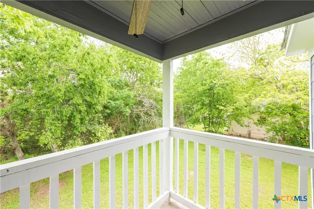 a view of balcony with trees