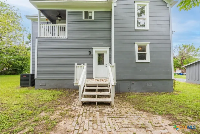 a house view with a backyard space