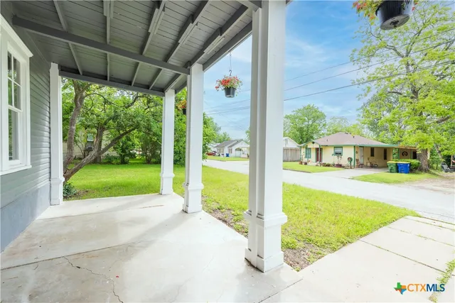 a view of swimming pool with a patio
