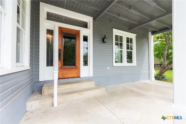 a front view of a house with a porch