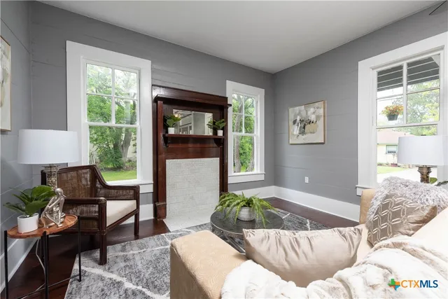 a living room with furniture and a window