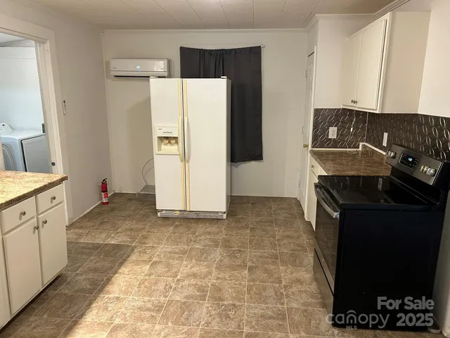 a view of cabinets a sink and dishwasher in a kitchen