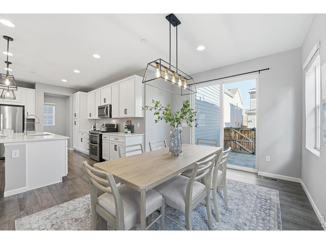 10094 Flower Street Broomfield, CO 80021 - Photo 13 of 40 a kitchen with a table and chairs in it