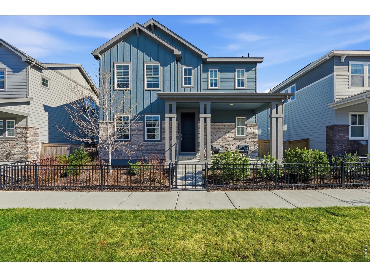 10094 Flower Street Broomfield, CO 80021 - Photo 2 of 40 a front view of a house with a yard