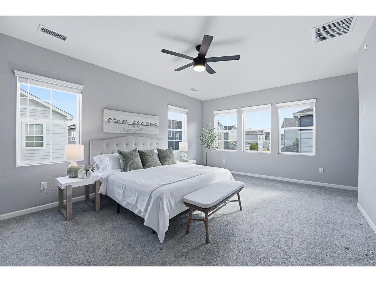 10094 Flower Street Broomfield, CO 80021 - Photo 23 of 40 a living room with a bed furniture and a window