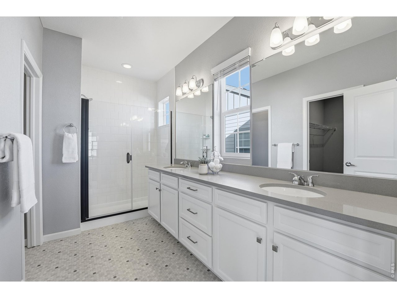 10094 Flower Street Broomfield, CO 80021 - Photo 24 of 40 a bathroom with a sink vanity and a mirror