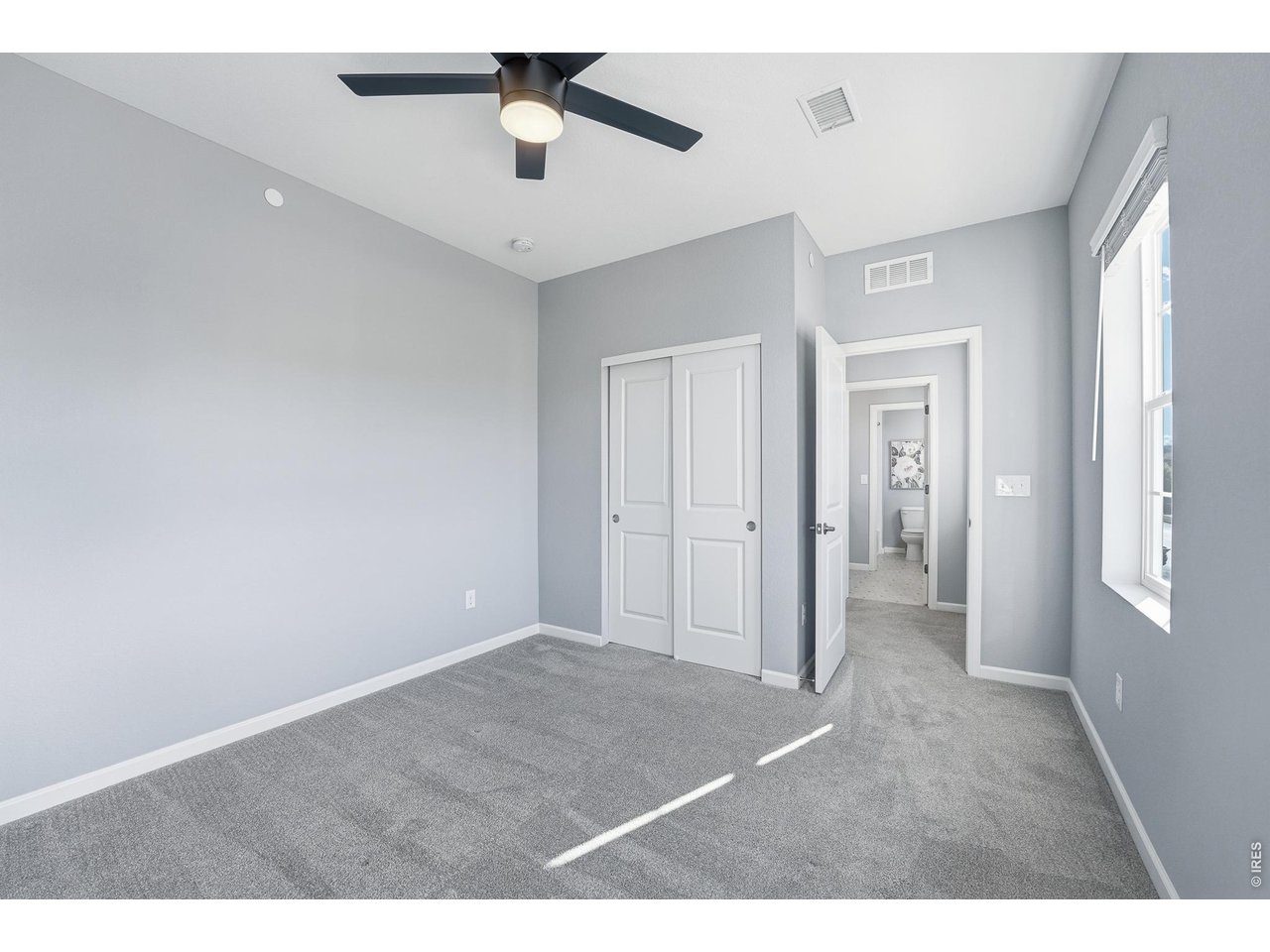 10094 Flower Street Broomfield, CO 80021 - Photo 27 of 40 a view of an empty room with a window