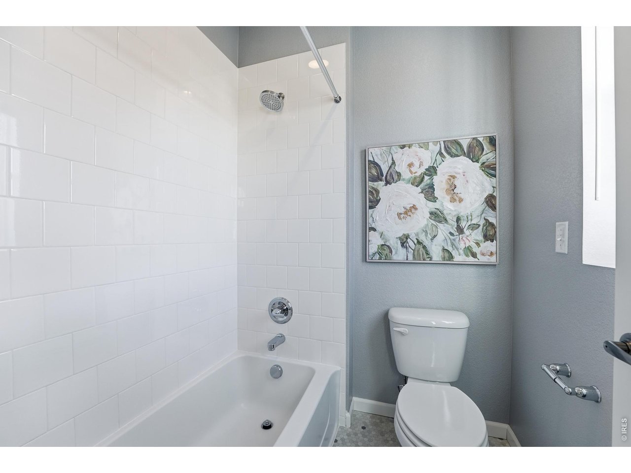 10094 Flower Street Broomfield, CO 80021 - Photo 29 of 40 a bathroom with a toilet sink and bathtub