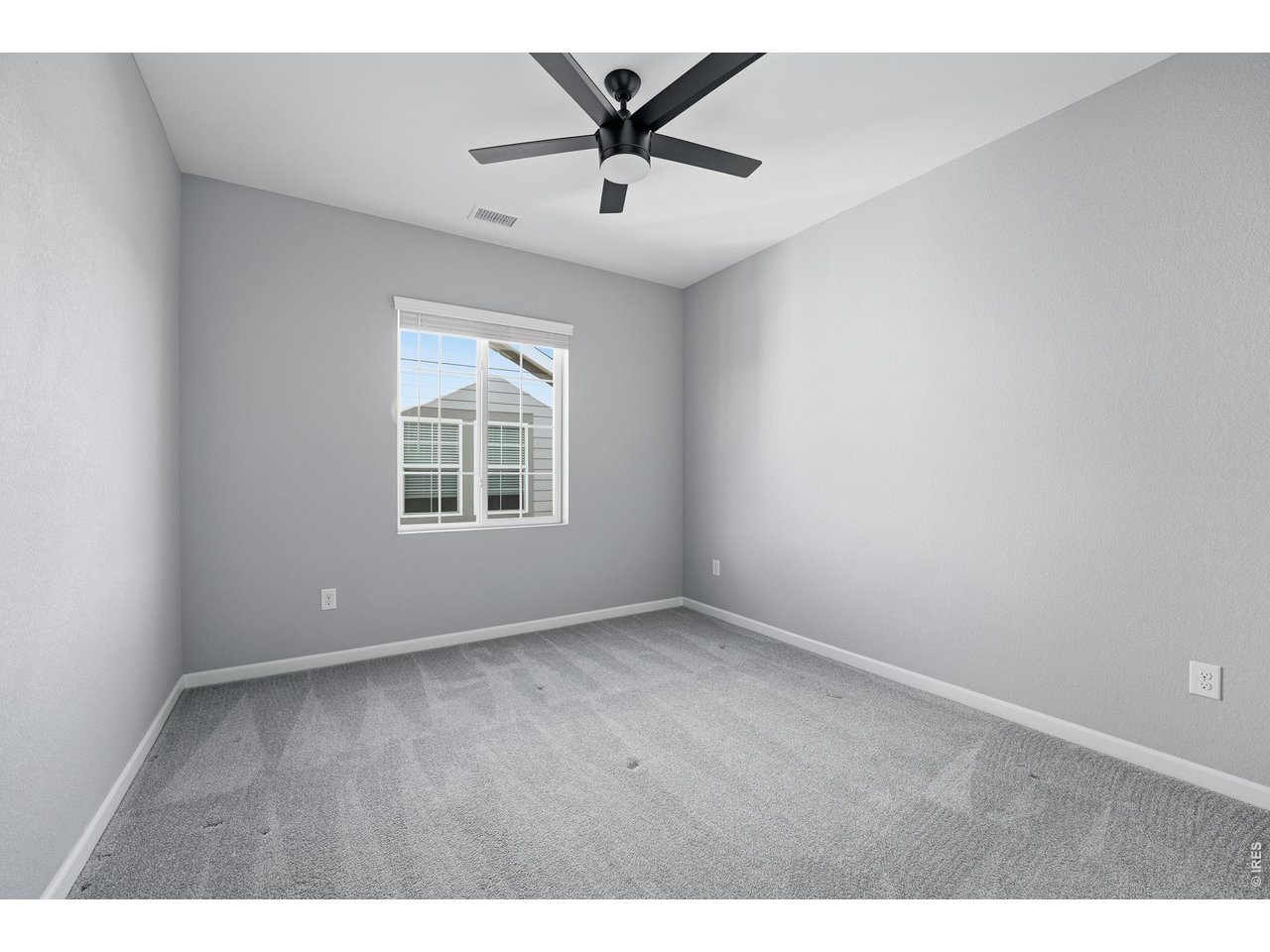 10094 Flower Street Broomfield, CO 80021 - Photo 31 of 40 a view of an empty room with a window