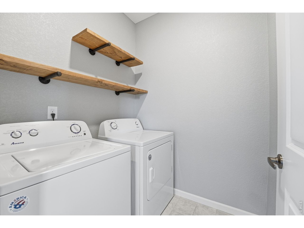 10094 Flower Street Broomfield, CO 80021 - Photo 33 of 40 a utility room with dryer and washer