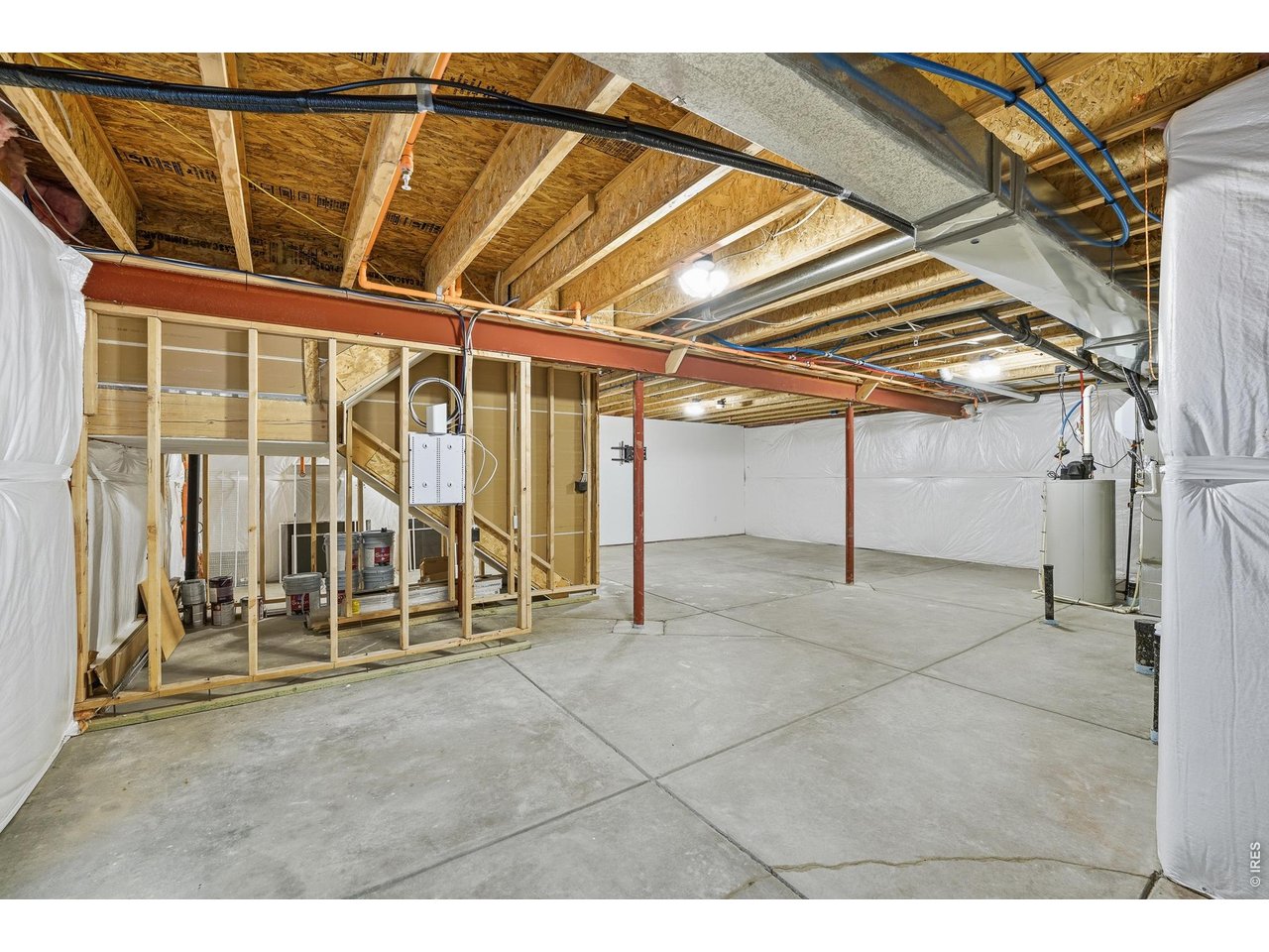 10094 Flower Street Broomfield, CO 80021 - Photo 35 of 40 a view of an empty room with wooden floor