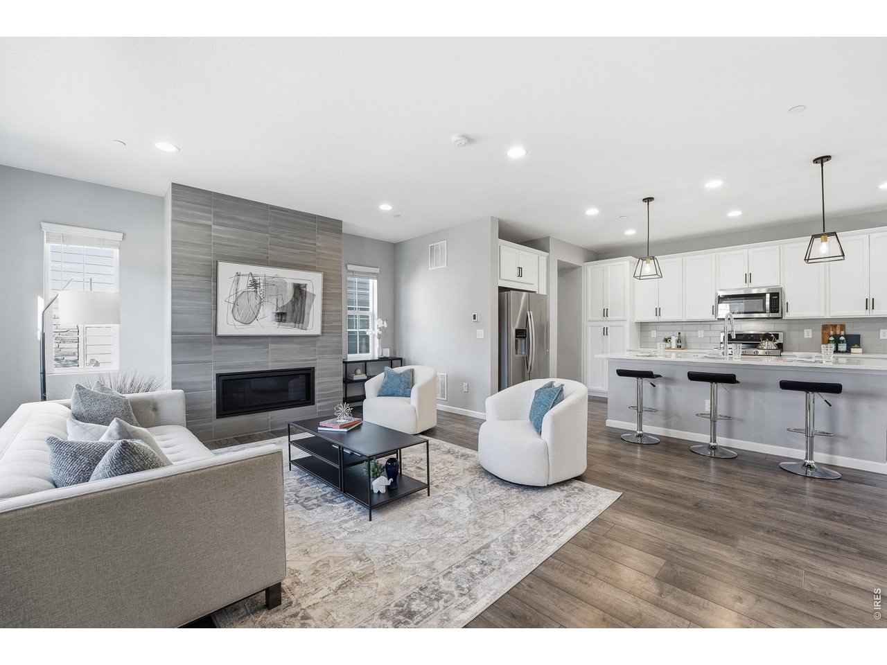 10094 Flower Street Broomfield, CO 80021 - Photo 5 of 40 a living room with furniture and a wooden floor