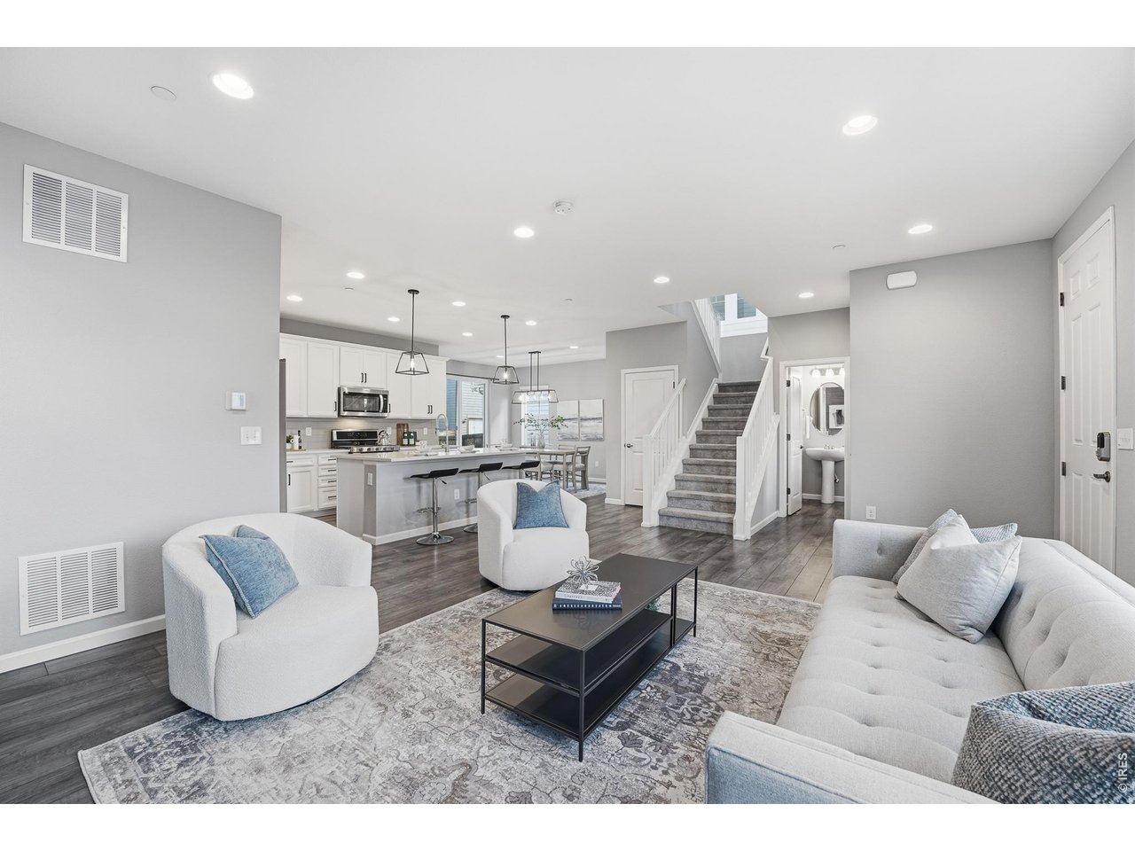 10094 Flower Street Broomfield, CO 80021 - Photo 7 of 40 a living room with furniture and kitchen view