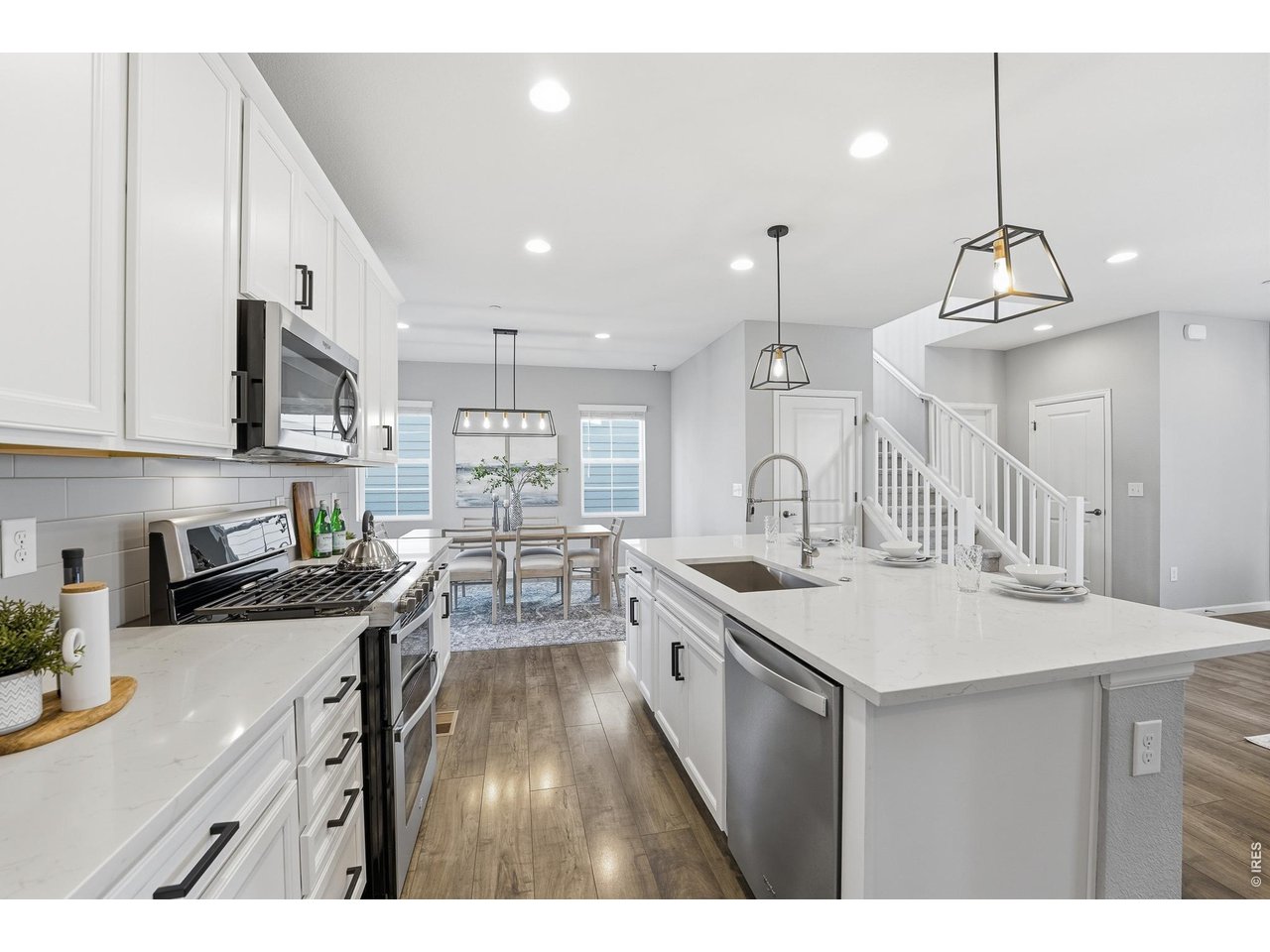 10094 Flower Street Broomfield, CO 80021 - Photo 10 of 40 a kitchen with sink stove and cabinets