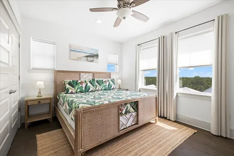 a bed room with a bed and windows