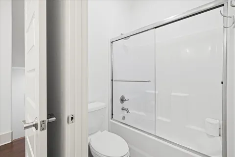 a bathroom with a shower and a toilet