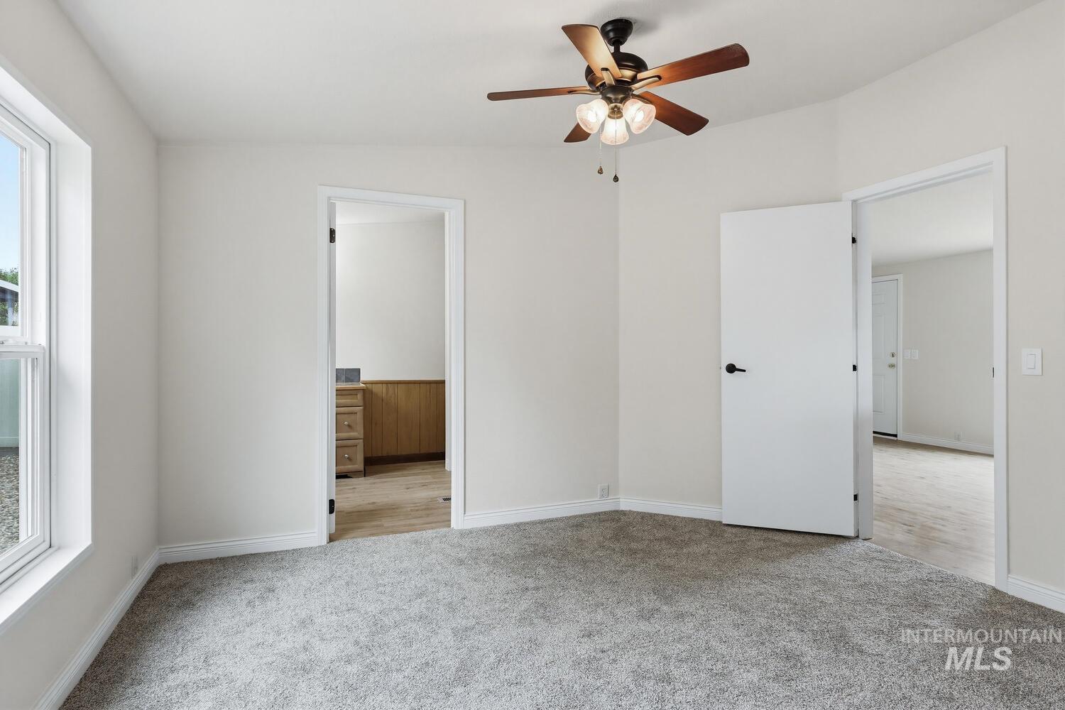 162 1st Street North Marsing, ID 83639 - Photo 17 of 39 Unfurnished bedroom with light colored carpet and a ceiling fan