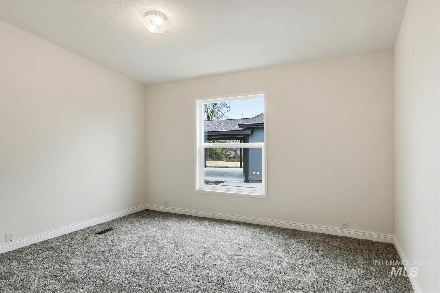 162 1st Street North Marsing, ID 83639 - Photo 20 of 39 Spare room featuring carpet flooring and baseboards