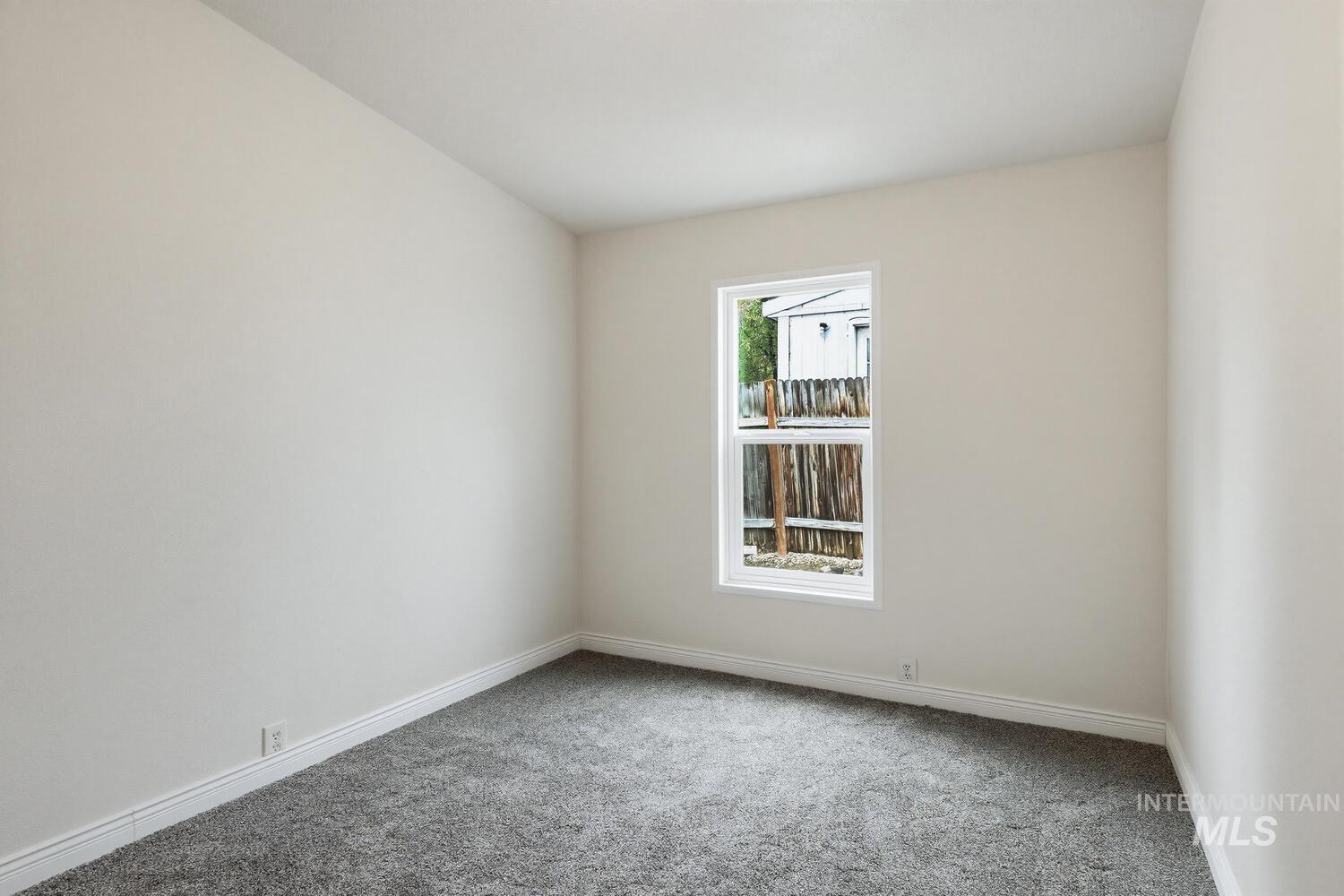 162 1st Street North Marsing, ID 83639 - Photo 23 of 39 Carpeted spare room featuring baseboards