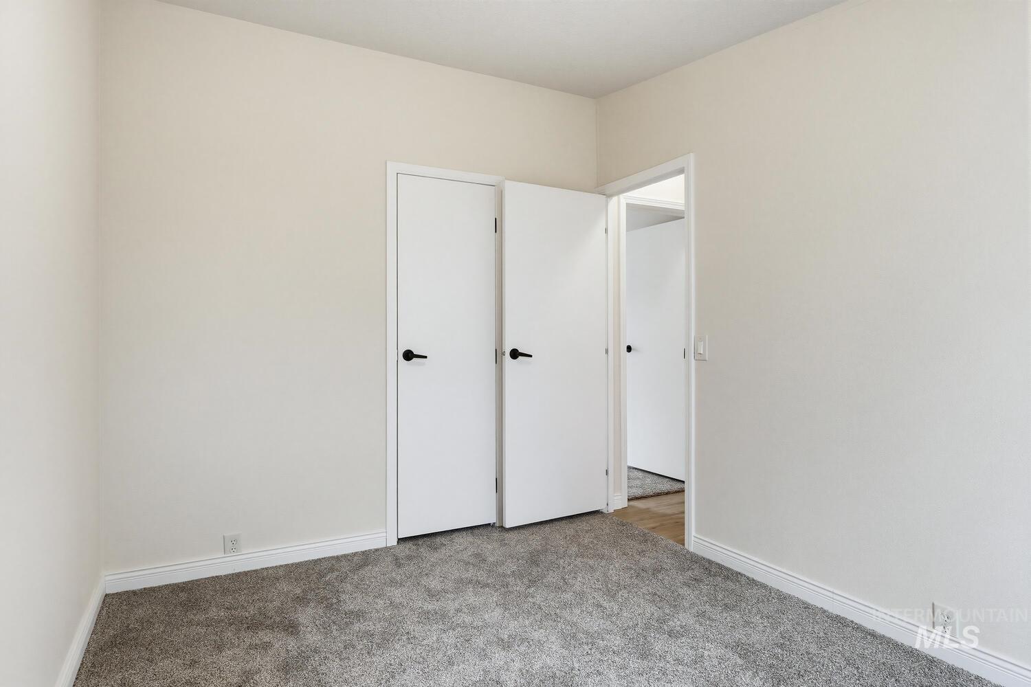 162 1st Street North Marsing, ID 83639 - Photo 24 of 39 Unfurnished bedroom featuring light colored carpet and baseboards