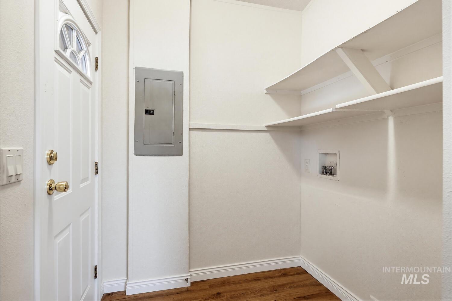 162 1st Street North Marsing, ID 83639 - Photo 25 of 39 Laundry area with electric panel, dark wood-style floors, and hookup for a washing machine