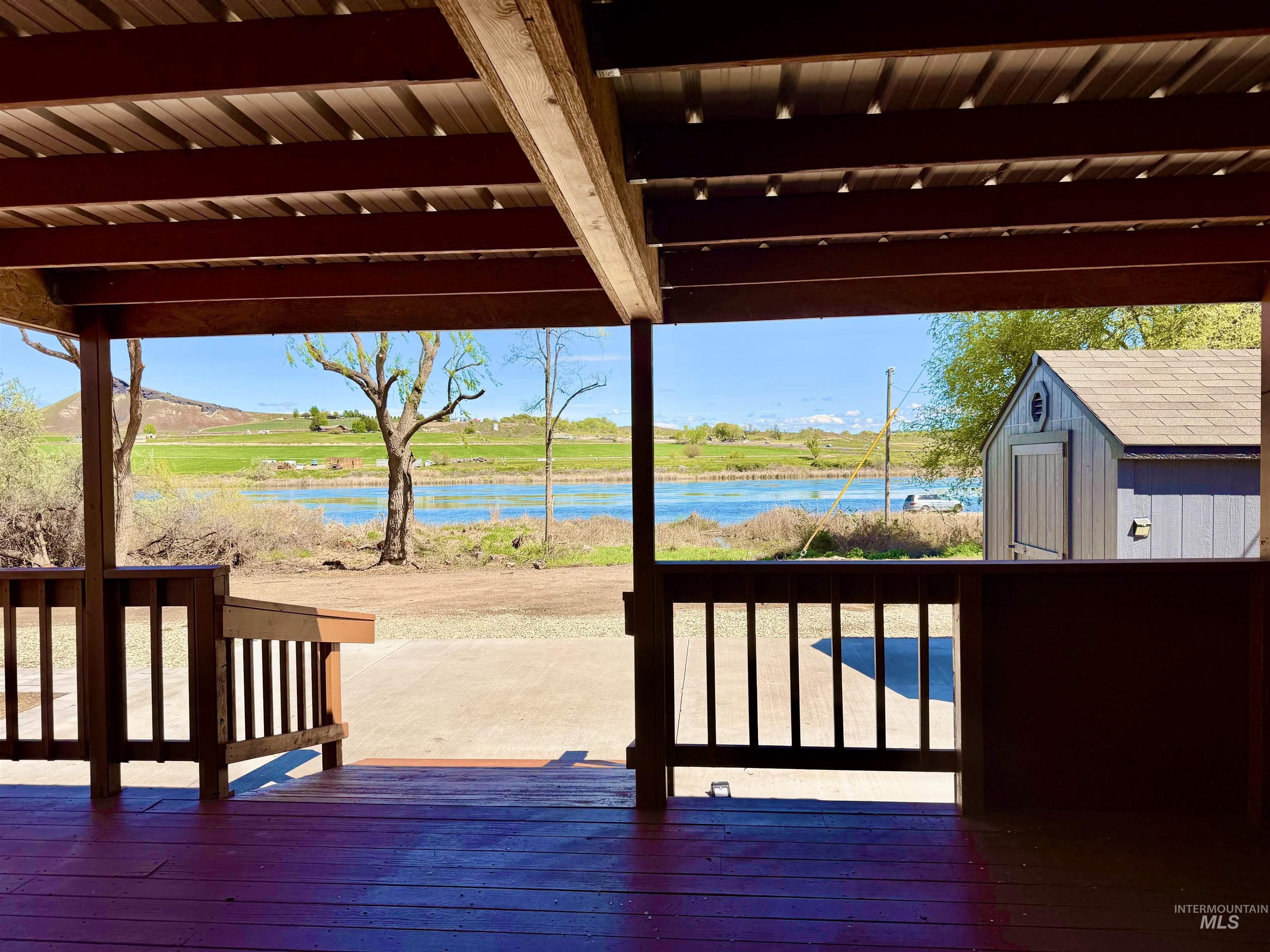 162 1st Street North Marsing, ID 83639 - Photo 27 of 39 Wooden deck featuring a shed and a water view