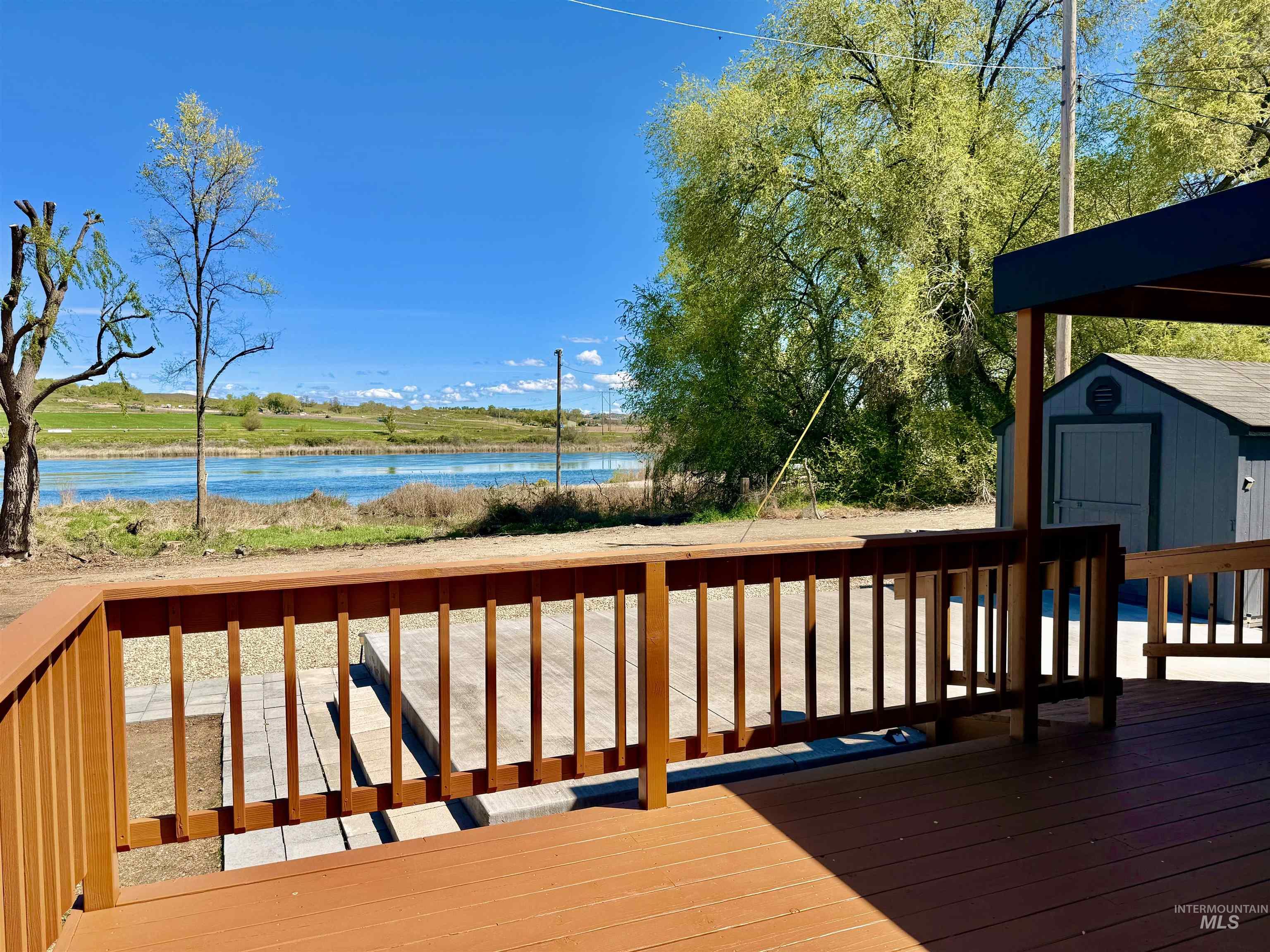 162 1st Street North Marsing, ID 83639 - Photo 30 of 39 Deck with a storage unit and a water view