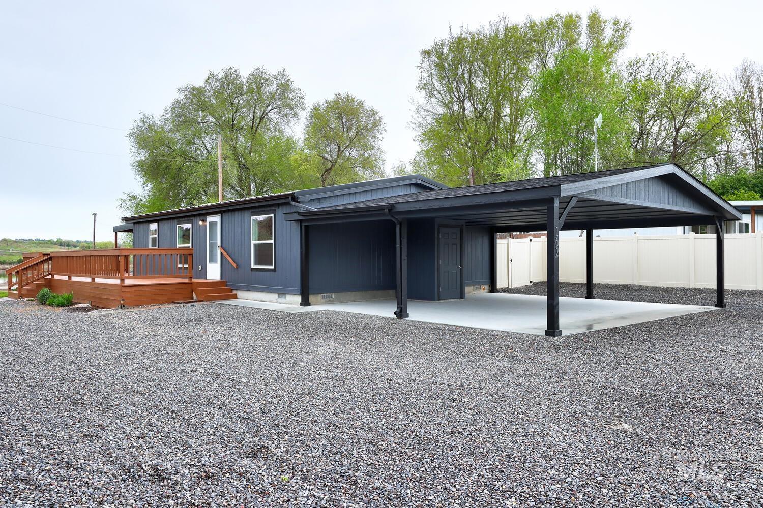 162 1st Street North Marsing, ID 83639 - Photo 3 of 39 Back of property featuring crawl space, a patio, an attached carport, and a deck