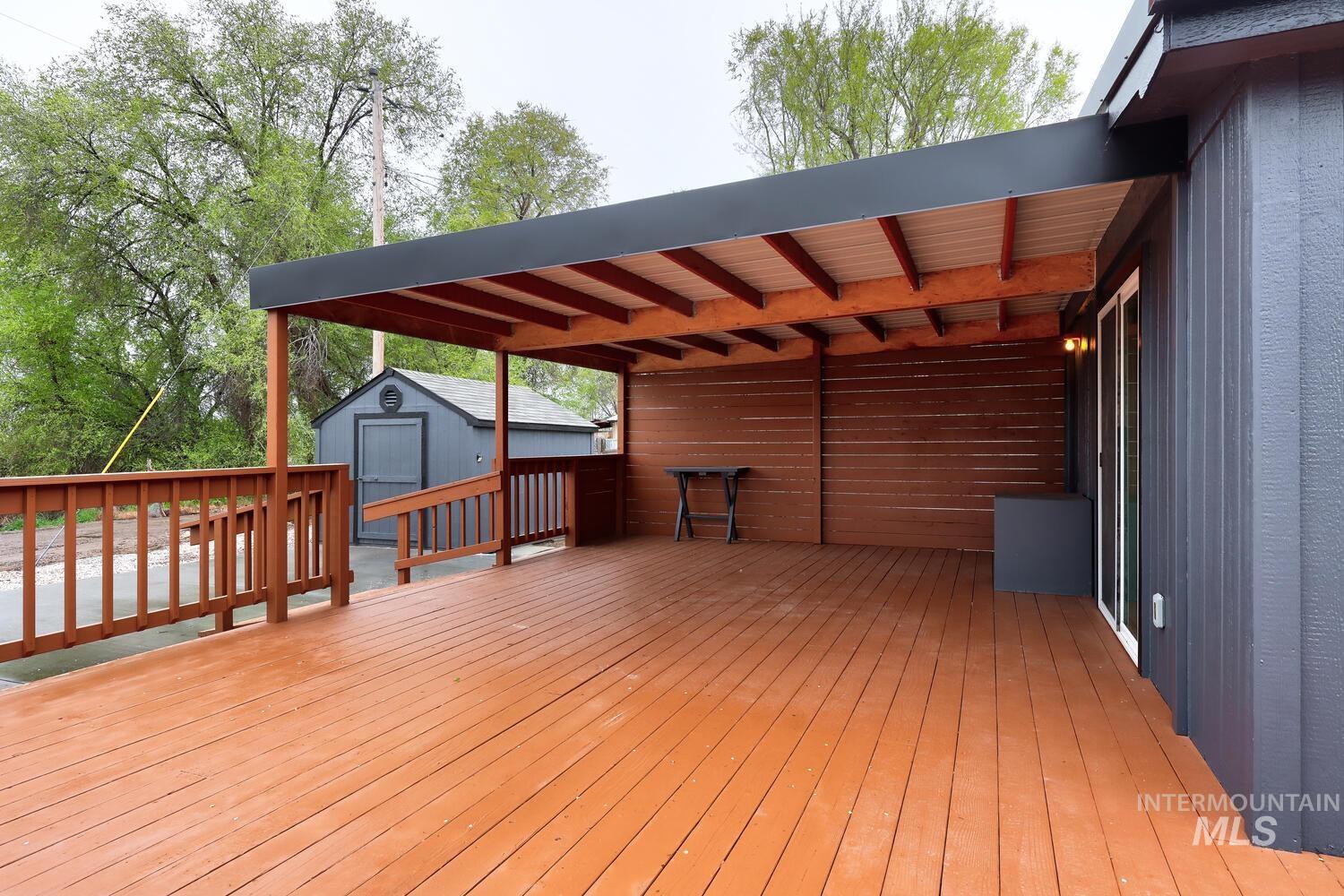 162 1st Street North Marsing, ID 83639 - Photo 32 of 39 Wooden terrace with a storage shed