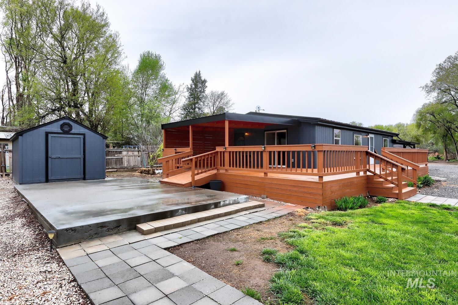 162 1st Street North Marsing, ID 83639 - Photo 33 of 39 Back of property featuring a shed and a deck