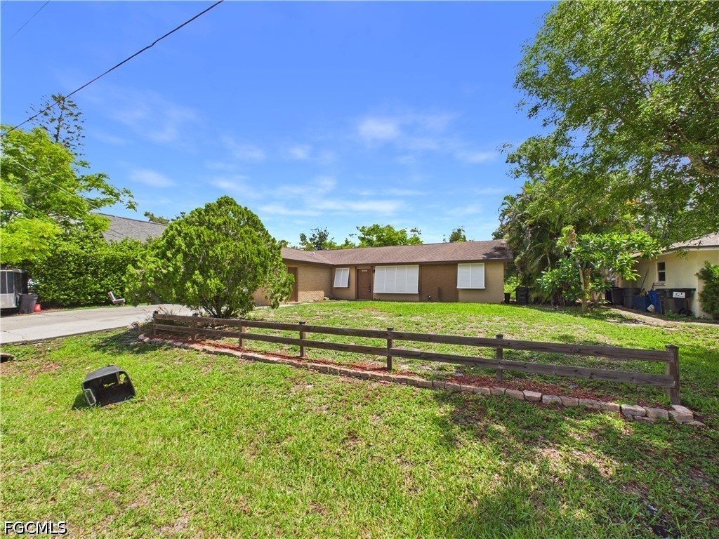 18541 Iris Road Fort Myers, FL 33967 - Photo 18 of 18 a view of a bench in the garden