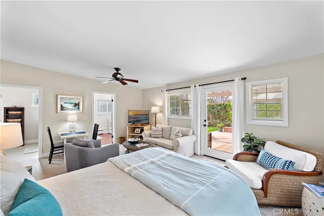 a bedroom with a bed a couch and dresser