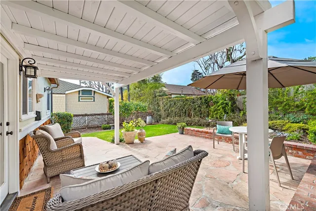 a view of yard with patio