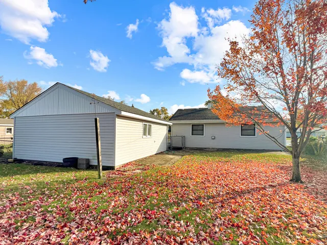a view of garage and yard