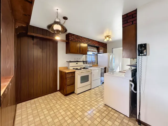 an empty room with windows and closet area