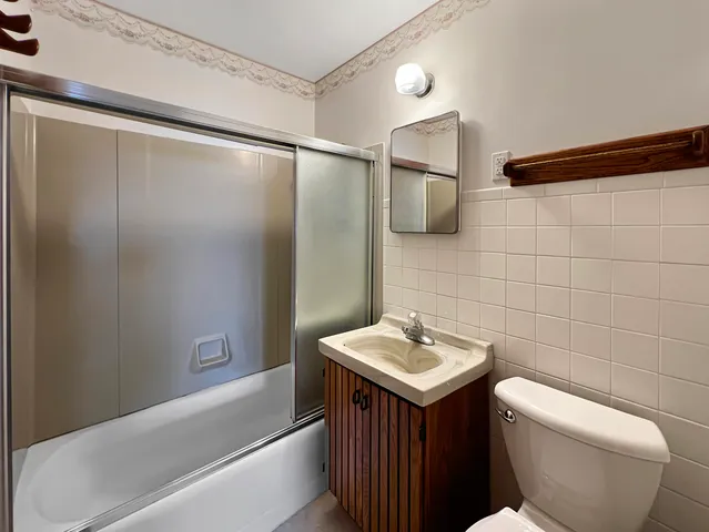 a view of bathroom with shower and bathtub