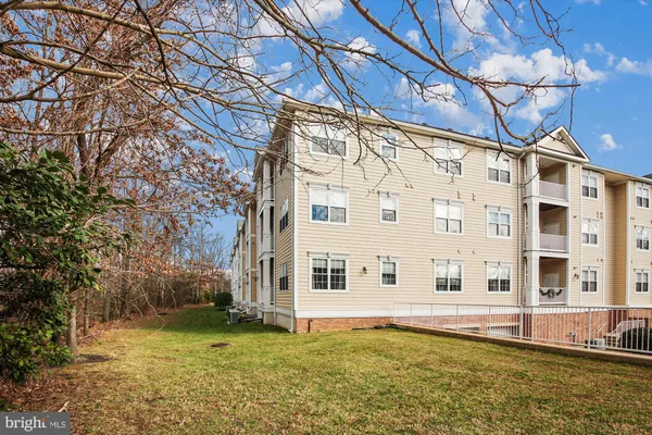a view of a large pool with a yard