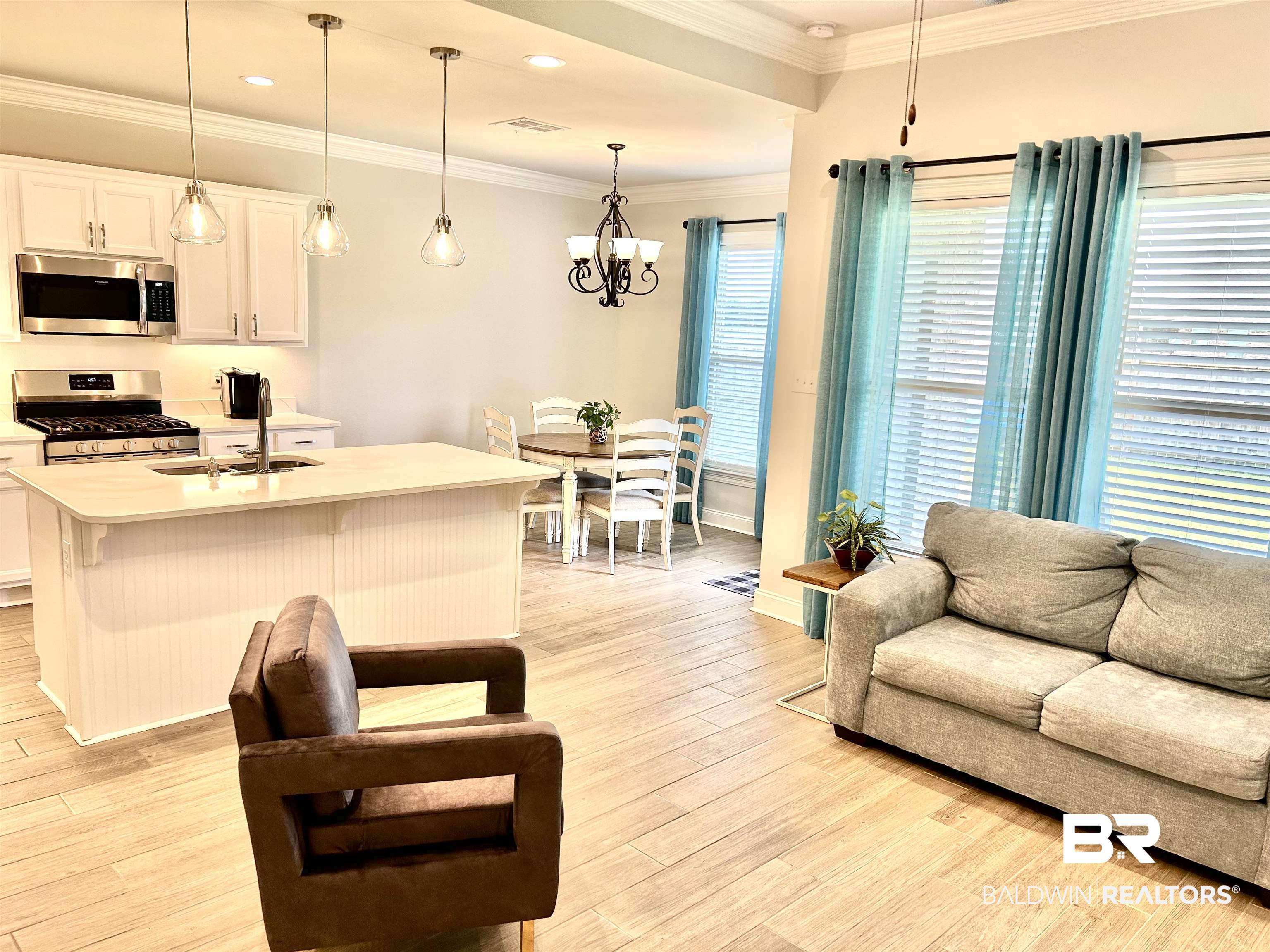 1398 Aldon Street Foley, AL 36535 - Photo 32 of 32 Living room featuring light wood-look tile flooring, and ornamental molding