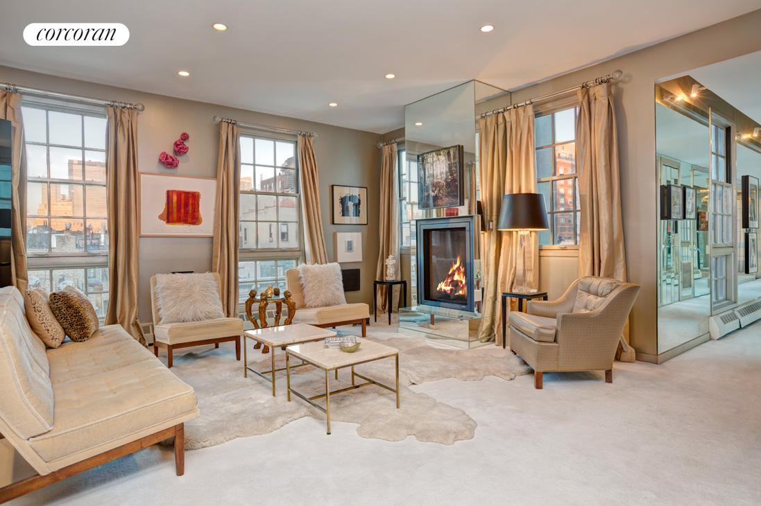 254 West 18th Street, Unit 5 Manhattan, NY 10011 - Photo 1 of 1 a living room with furniture and a large window