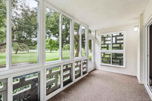 a view of an empty room with windows