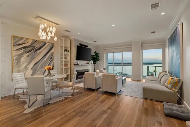 a living room with fireplace furniture and a flat screen tv